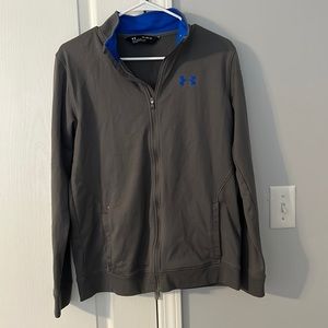 A gray under armor zip up for a youth, size XL